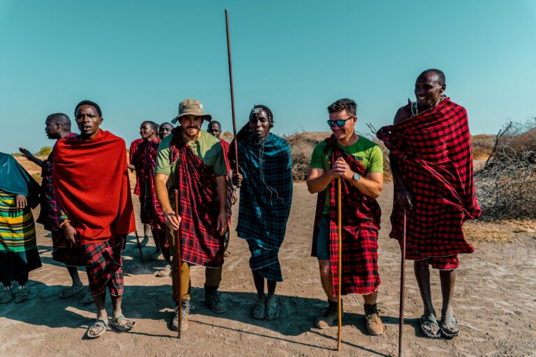 Group of men in traditional Maasai attire in the Arusha Region, Tanzania, embodying cultural heritage.